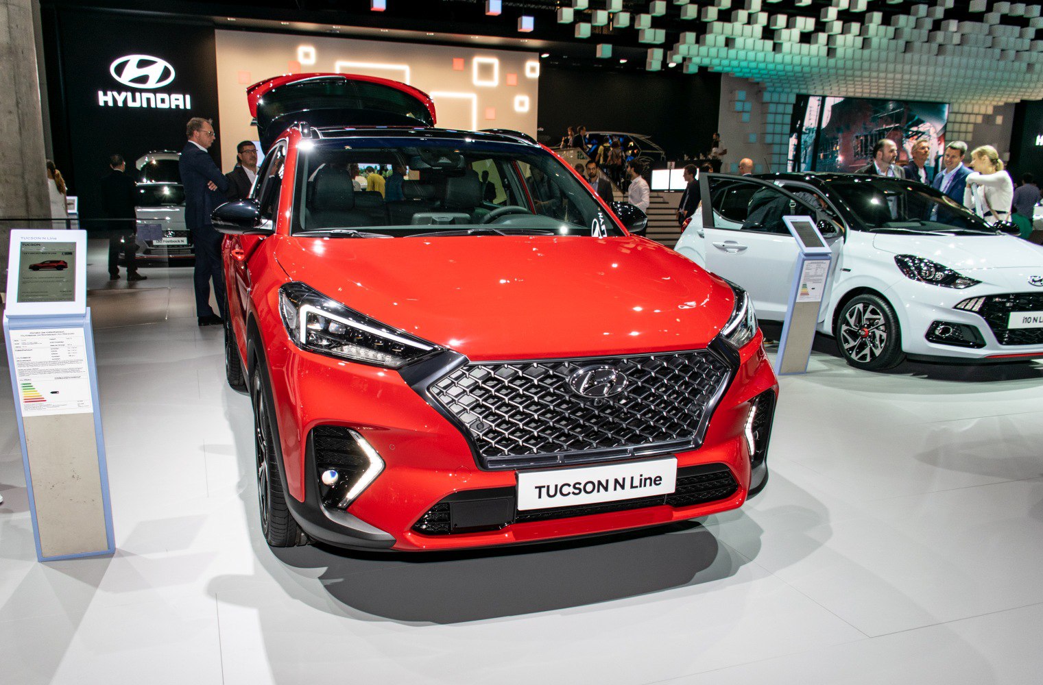 Front grille and LED headlights of a red SUV