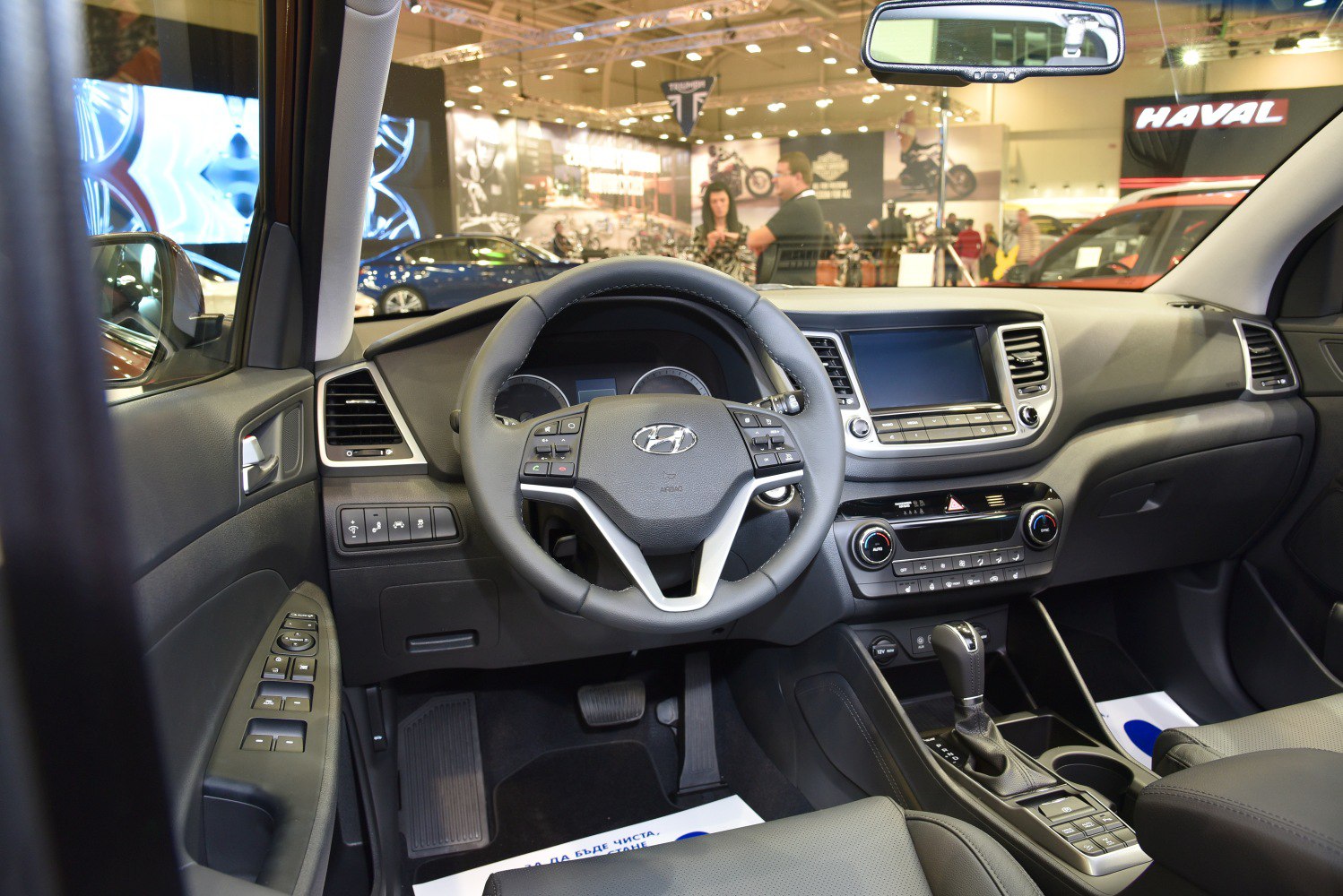 Dashboard and steering wheel view with center console and control buttons