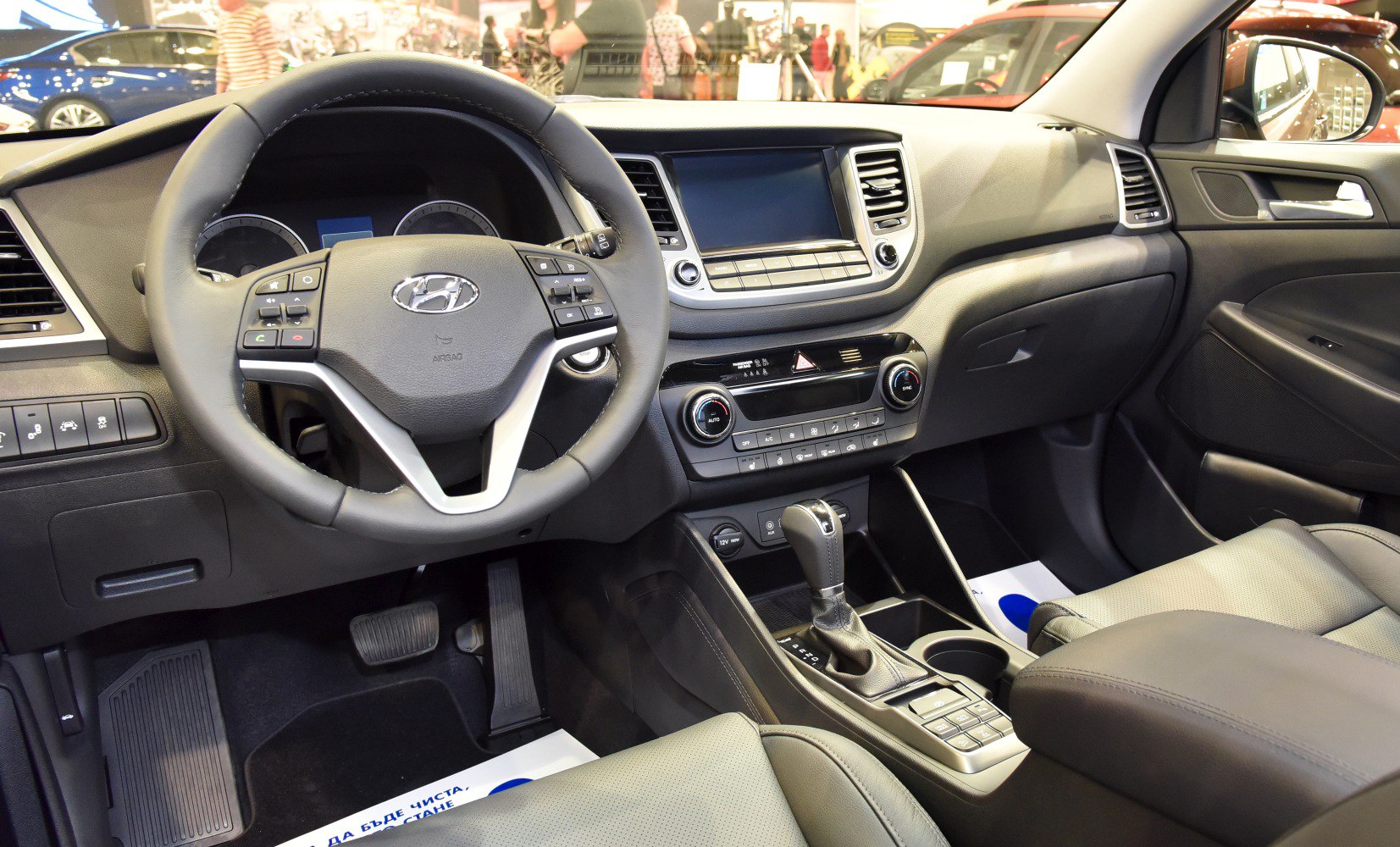 Dashboard, steering wheel, and center console of a modern car interior.