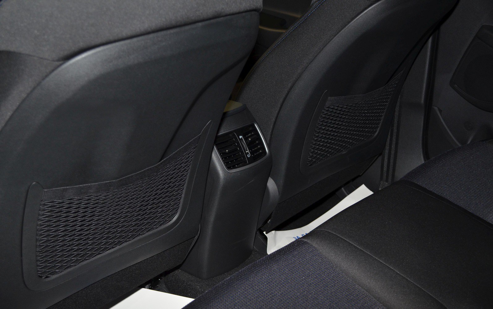 Rear seat air vents and mesh storage nets on back of front seats