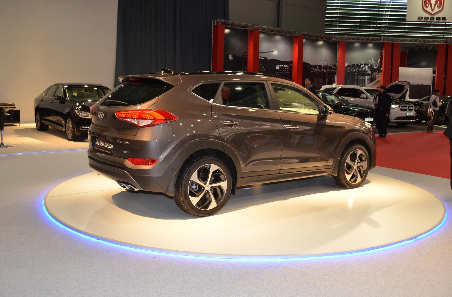 Rear-side view of SUV with alloy wheels on rotating display platform