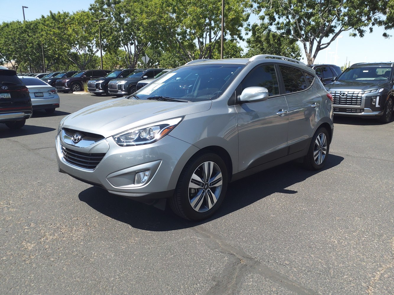 Silver SUV front side view with distinct headlights and alloy wheels