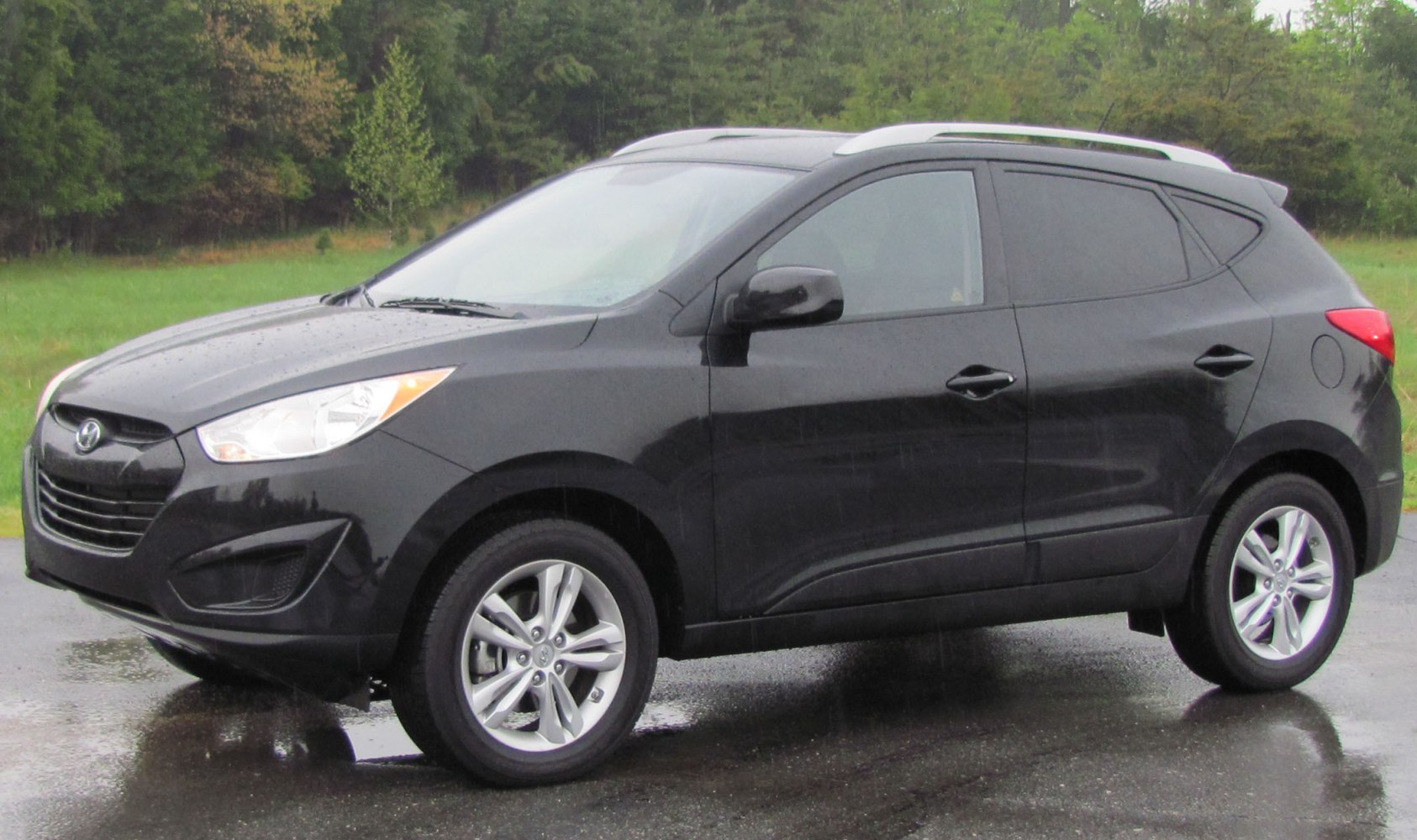 Black SUV side profile with alloy wheels and tinted windows