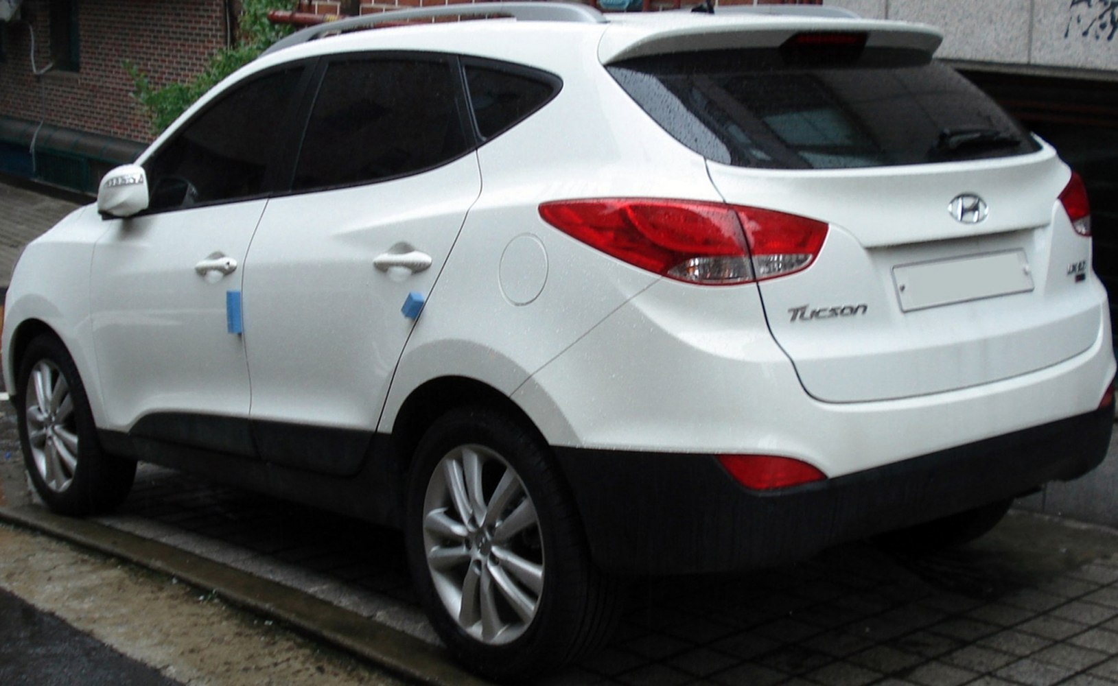 Rear and side profile with taillights and alloy wheels