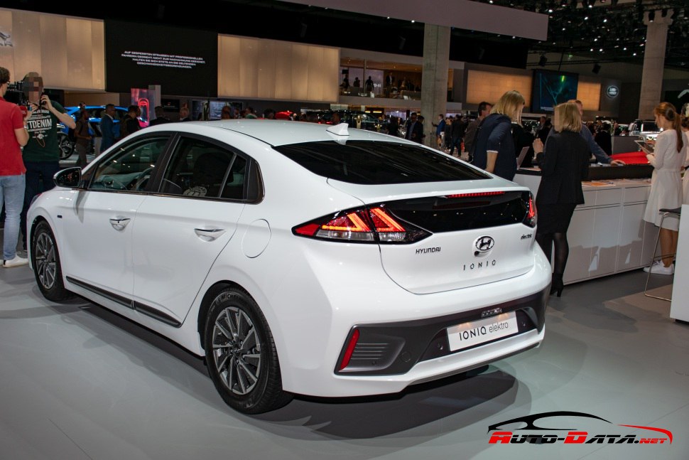 Rear view of a white electric hatchback with sleek taillights and aerodynamic design