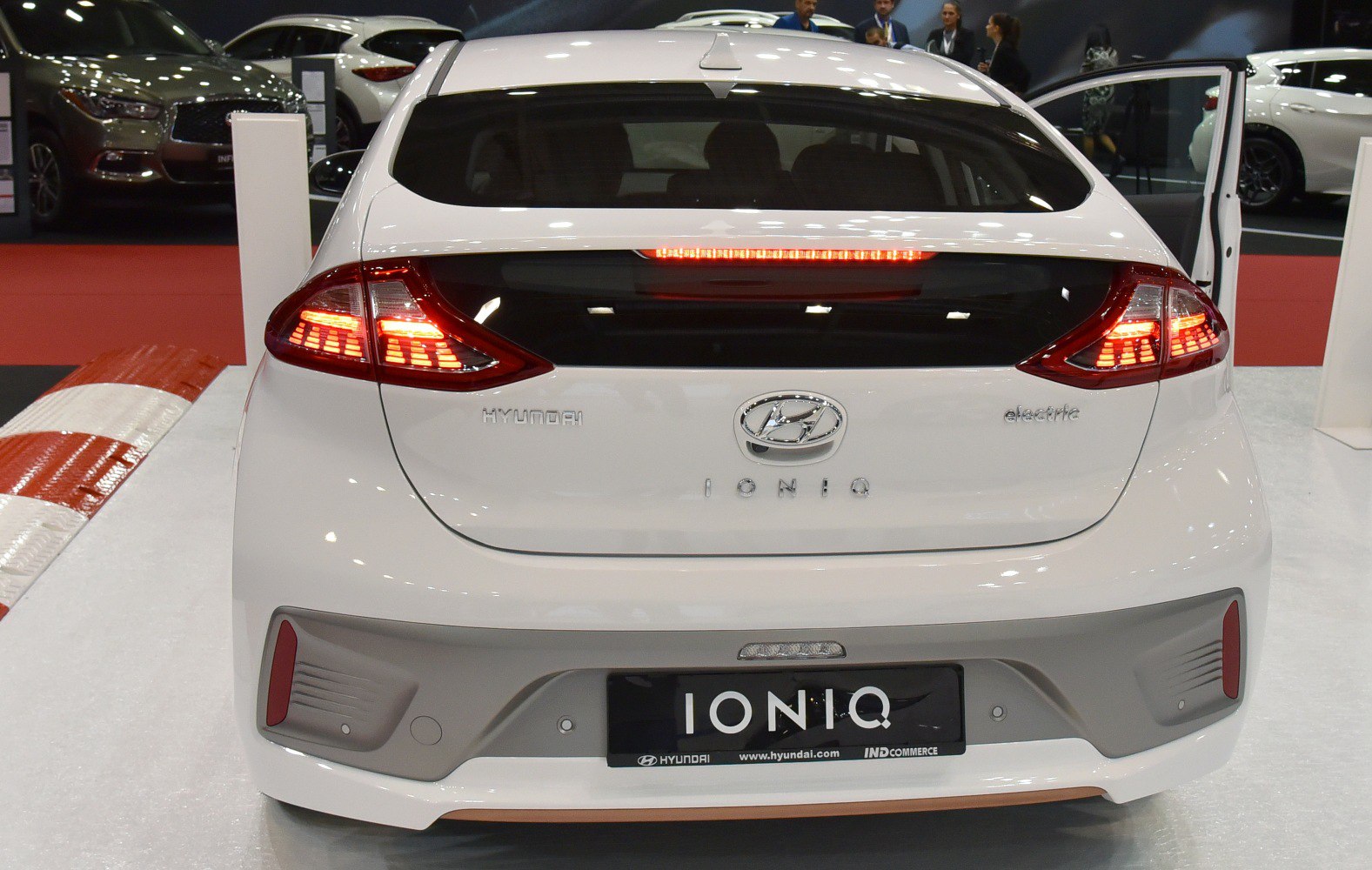 Rear view of white electric hatchback with distinct taillights