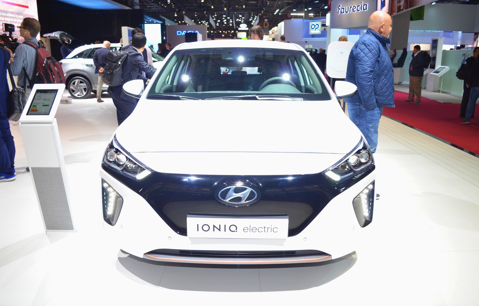 Front view of electric vehicle with LED headlights and sleek grille design