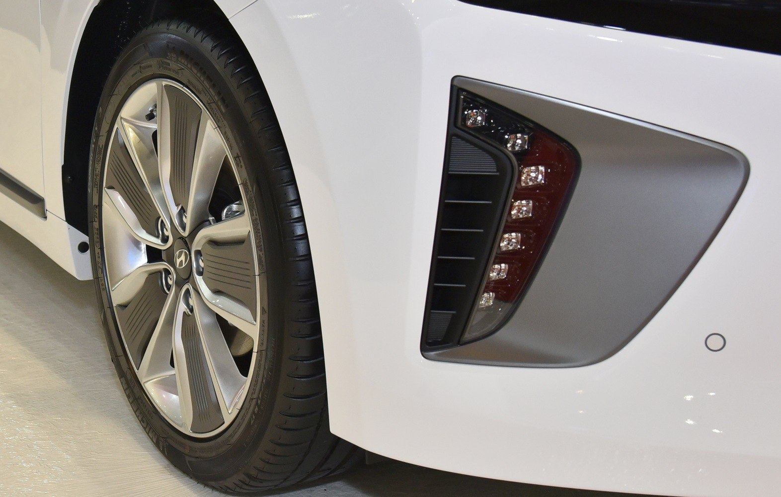 Alloy wheel and rear light cluster of a vehicle.
