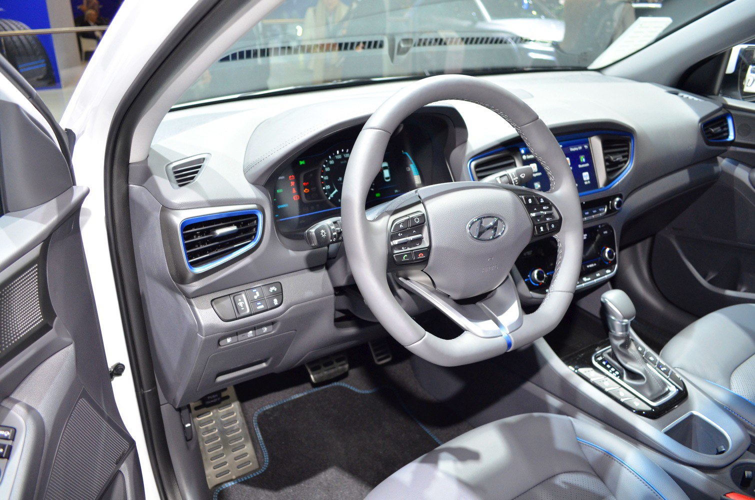 Modern car interior with multifunction steering wheel and digital instrument cluster