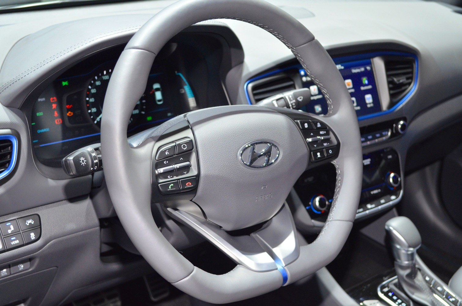 Digital dashboard with multifunction steering wheel and center console infotainment system