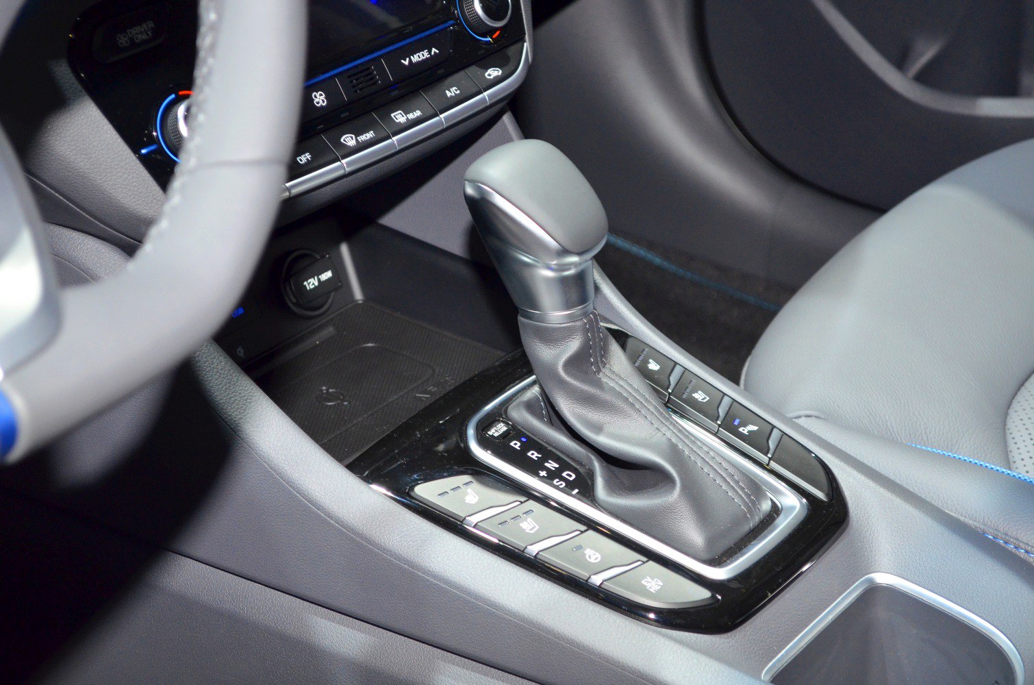 Automatic gear shift with surrounding console buttons and controls