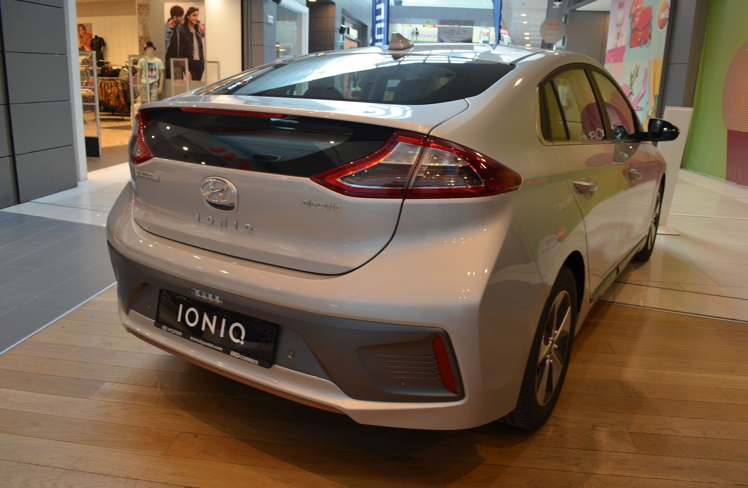 Rear view of an electric hatchback with distinctive tail lights and aerodynamic design