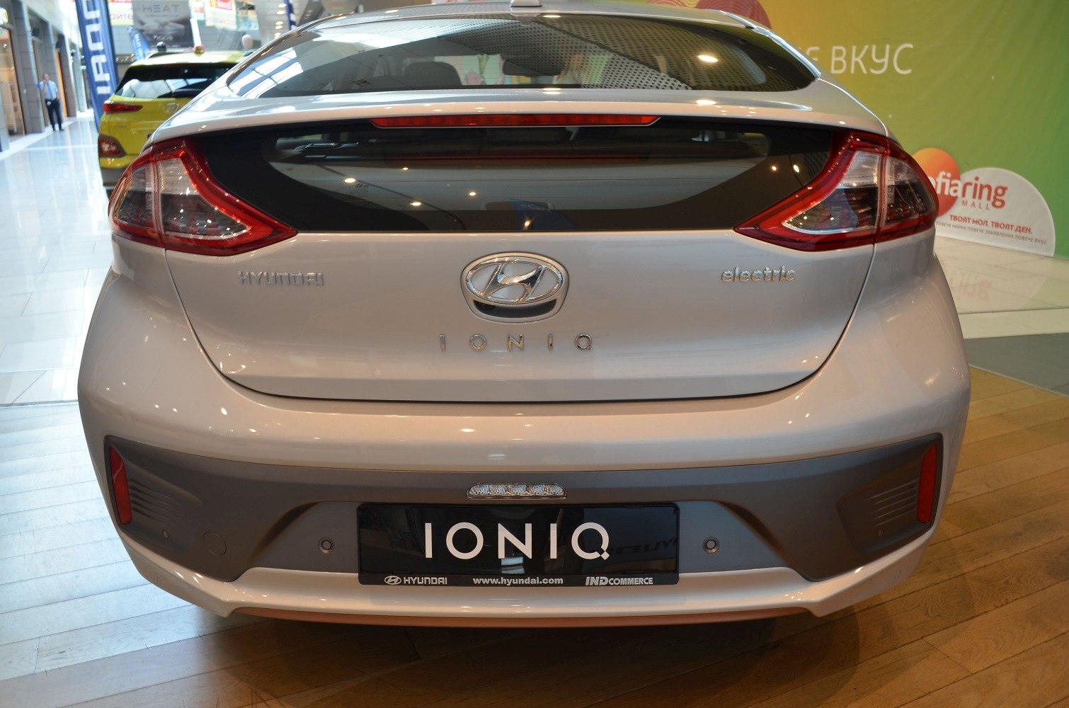 Rear view with distinctive taillights and electric badge