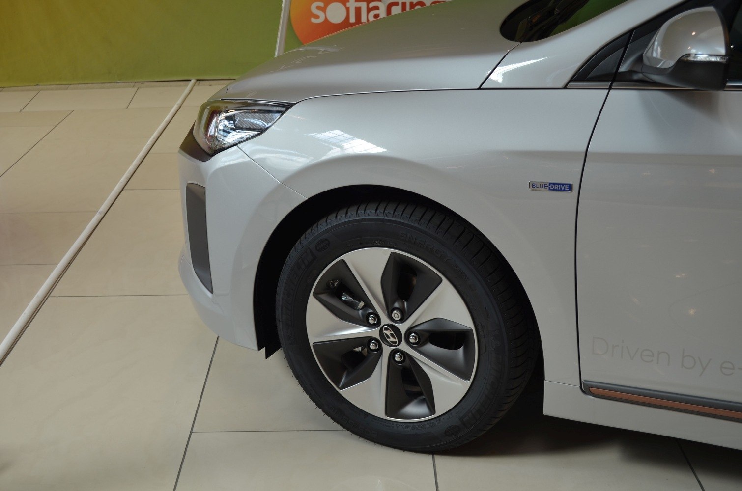 Close-up of front wheel and headlight with Blue Drive badge