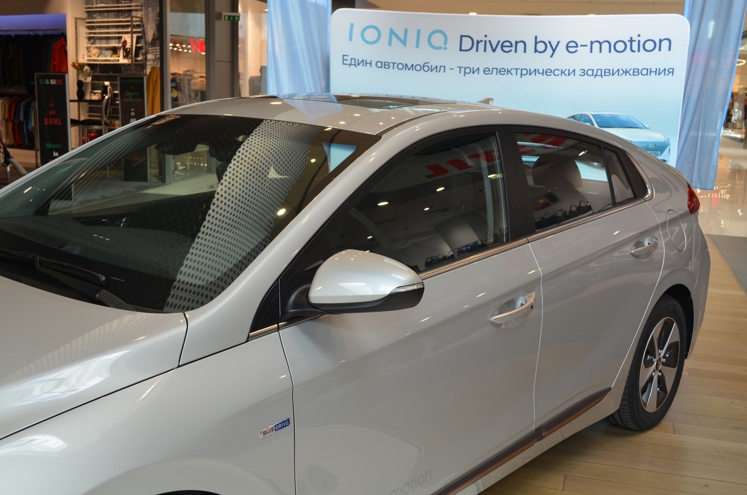 Side view with Blue Drive badge and side mirror of a sedan