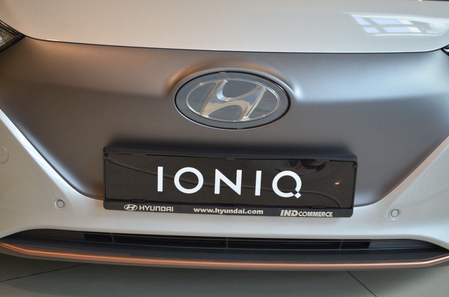 Hyundai front badge and grille close-up with license plate area