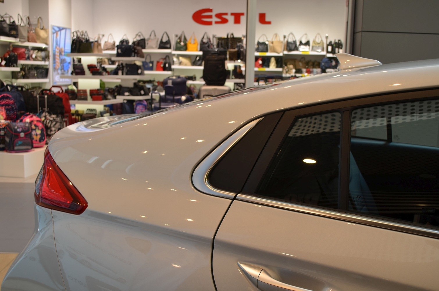 Rear side with sharp tail light and sleek window trim