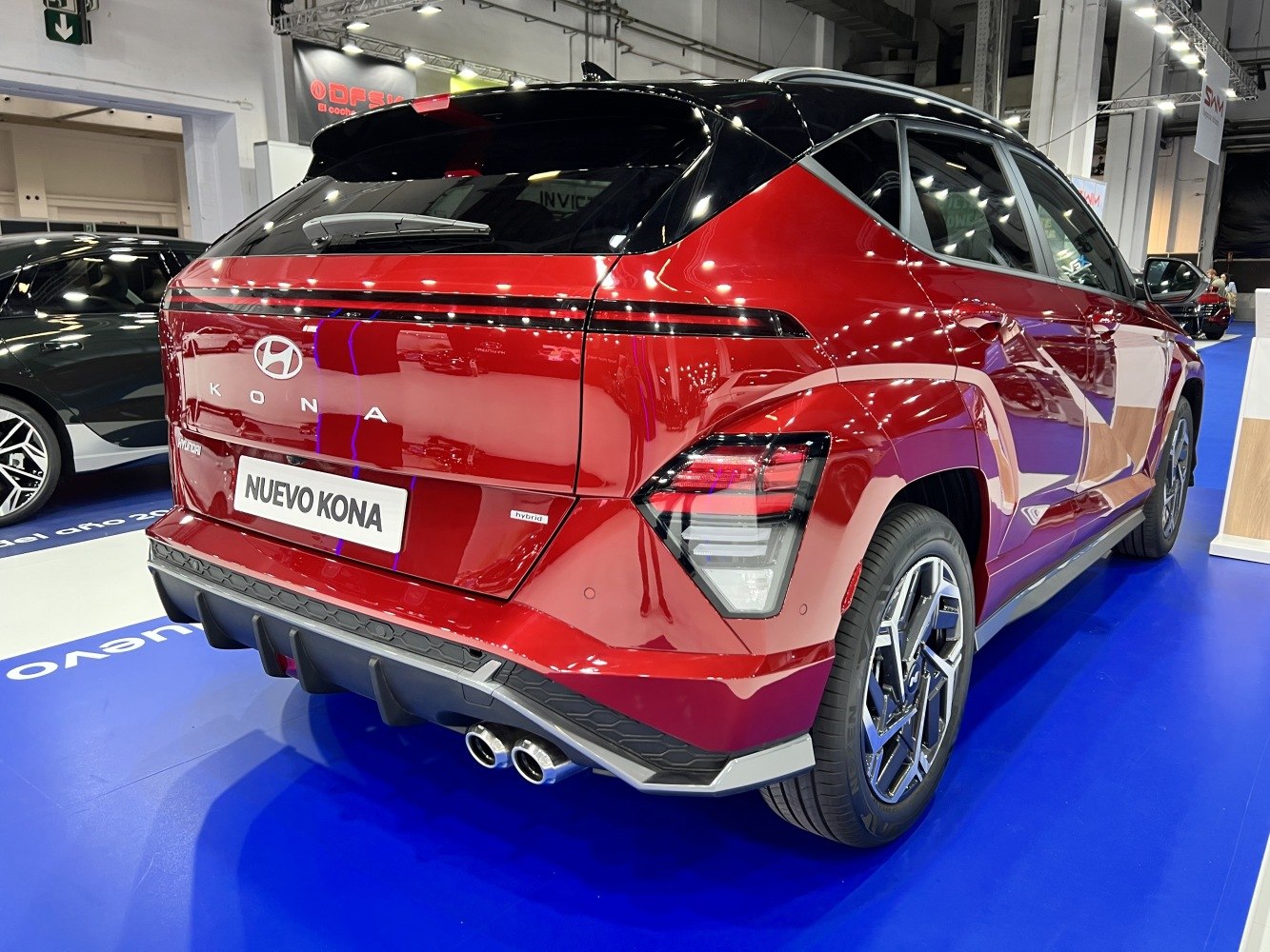 Rear view of SUV with hybrid badge and dual exhausts