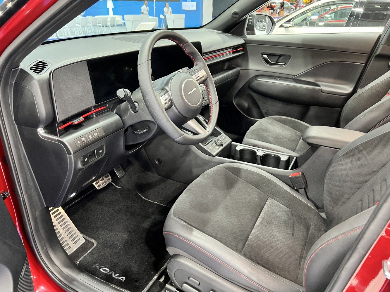 Modern digital dashboard and sporty ergonomic steering wheel in car interior