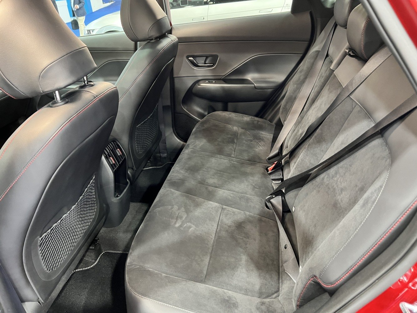 Black rear seat interior with upholstery and rear air vents