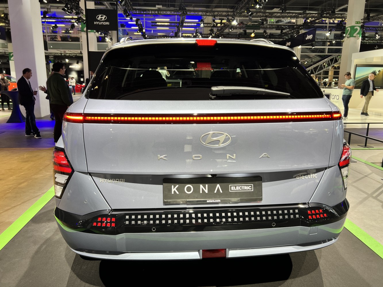 Rear view of electric vehicle with horizontal LED light bar and distinctive tail lights