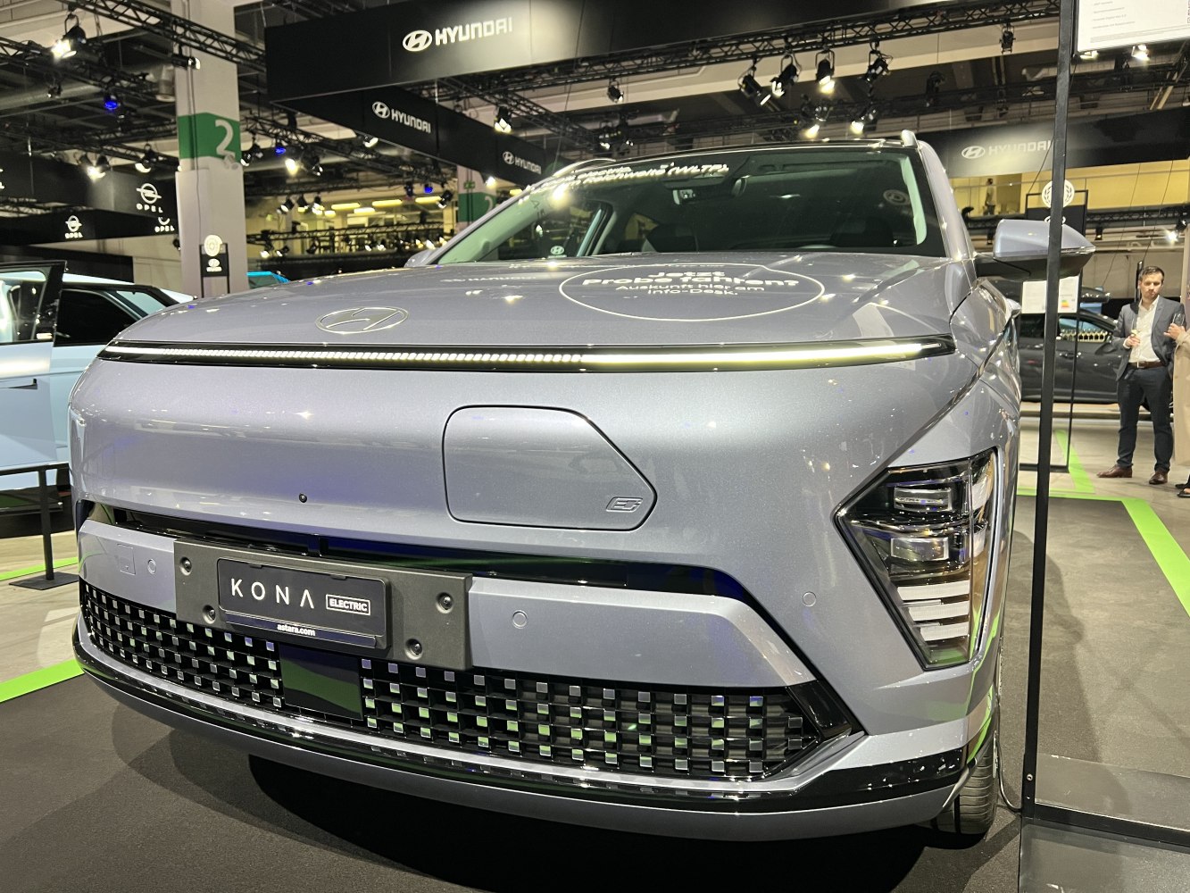 Sleek front grille and distinctive LED headlight design with electric vehicle charging port