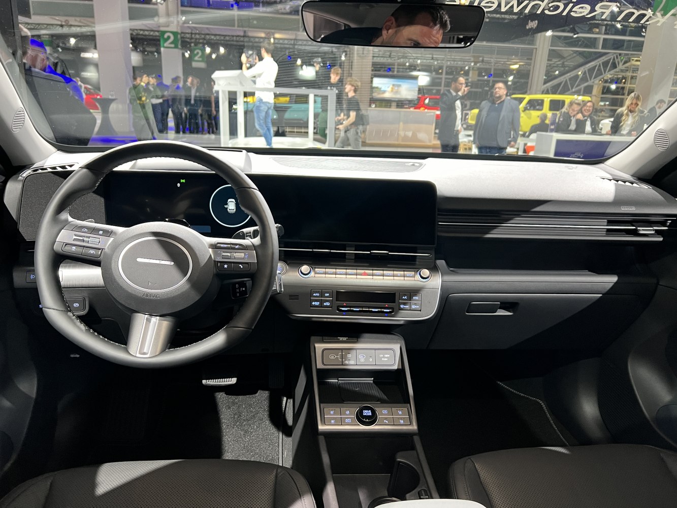 Digital dashboard and multifunction steering wheel with center console controls