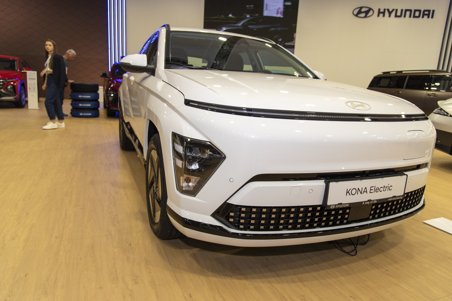 Front view with split LED headlights and modern grille design