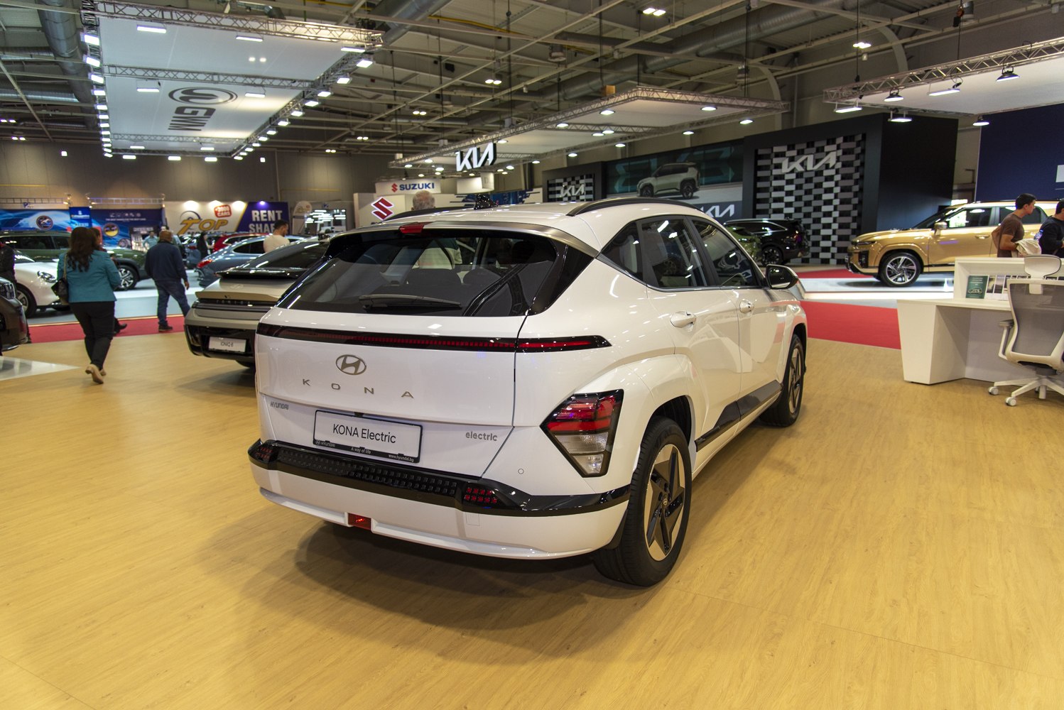 Rear view of an electric SUV with sleek LED taillights and sharp angular design