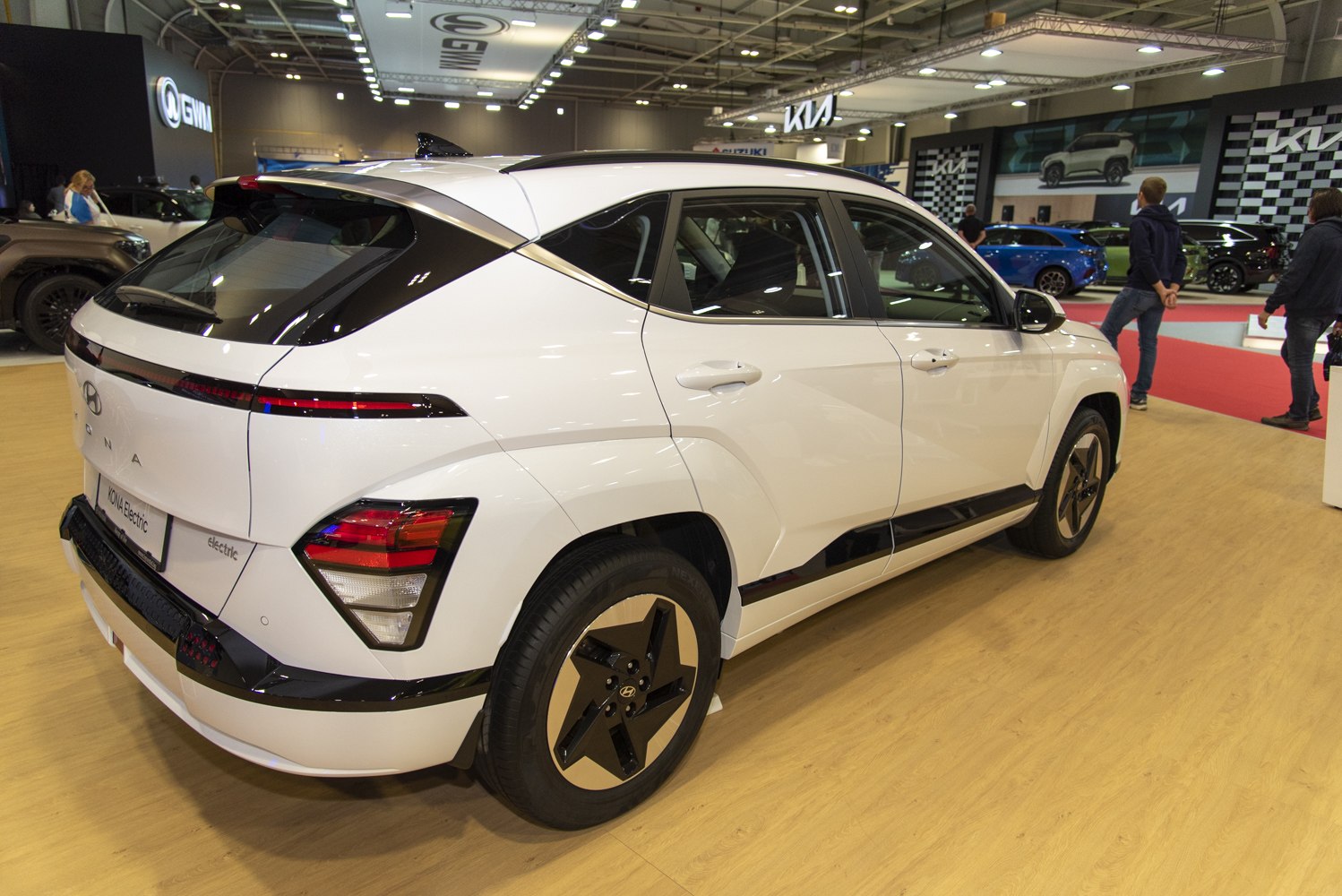 Rear side view with sleek taillights and unique wheel design