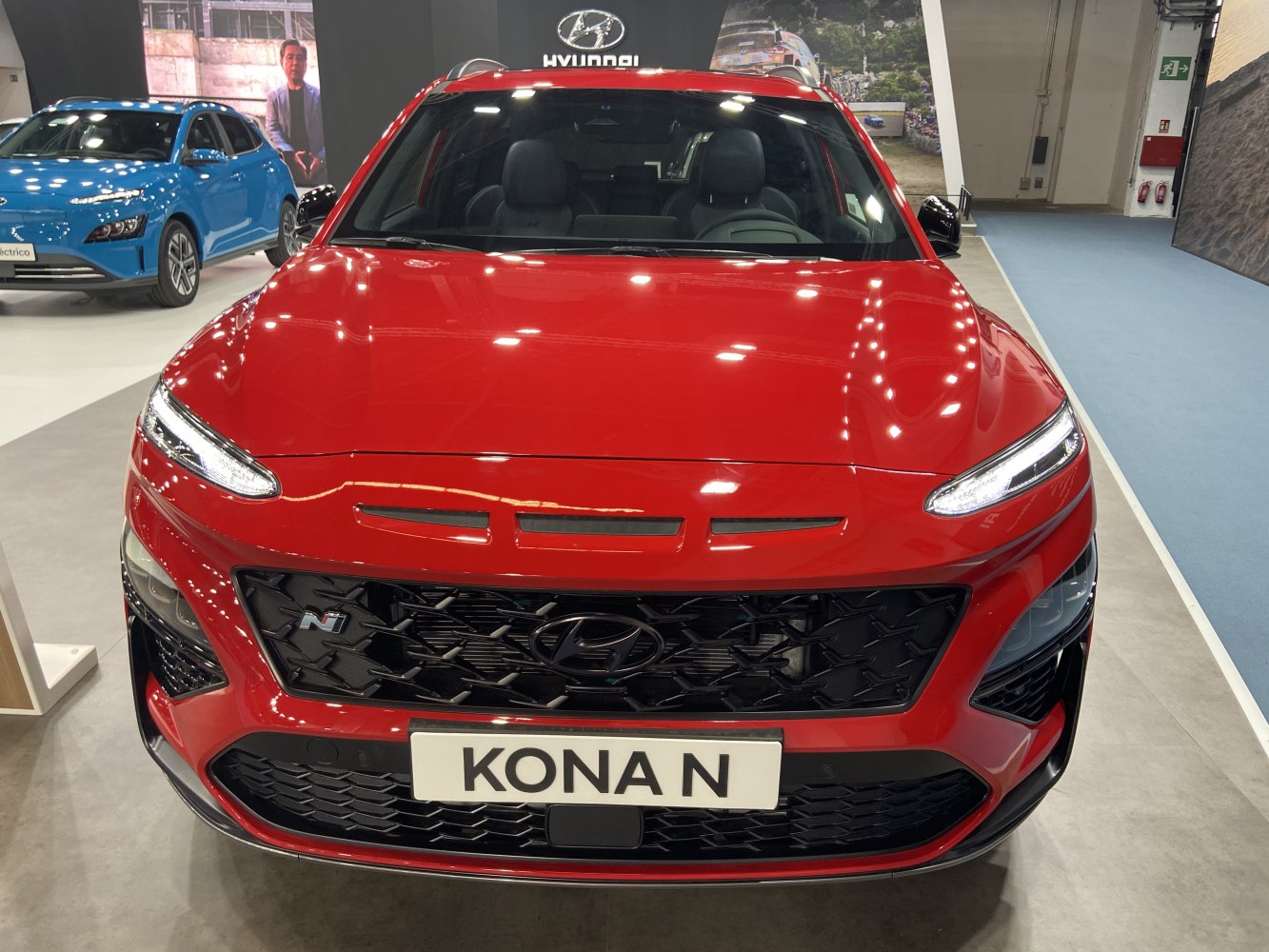 Front grille and LED headlights close-up of a red SUV.