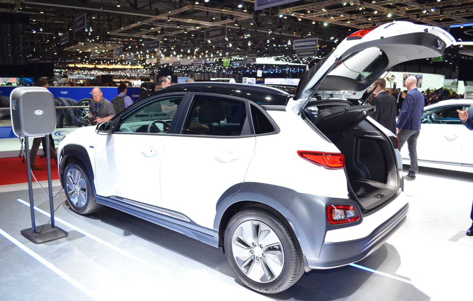 White SUV with open rear hatch showing cargo space