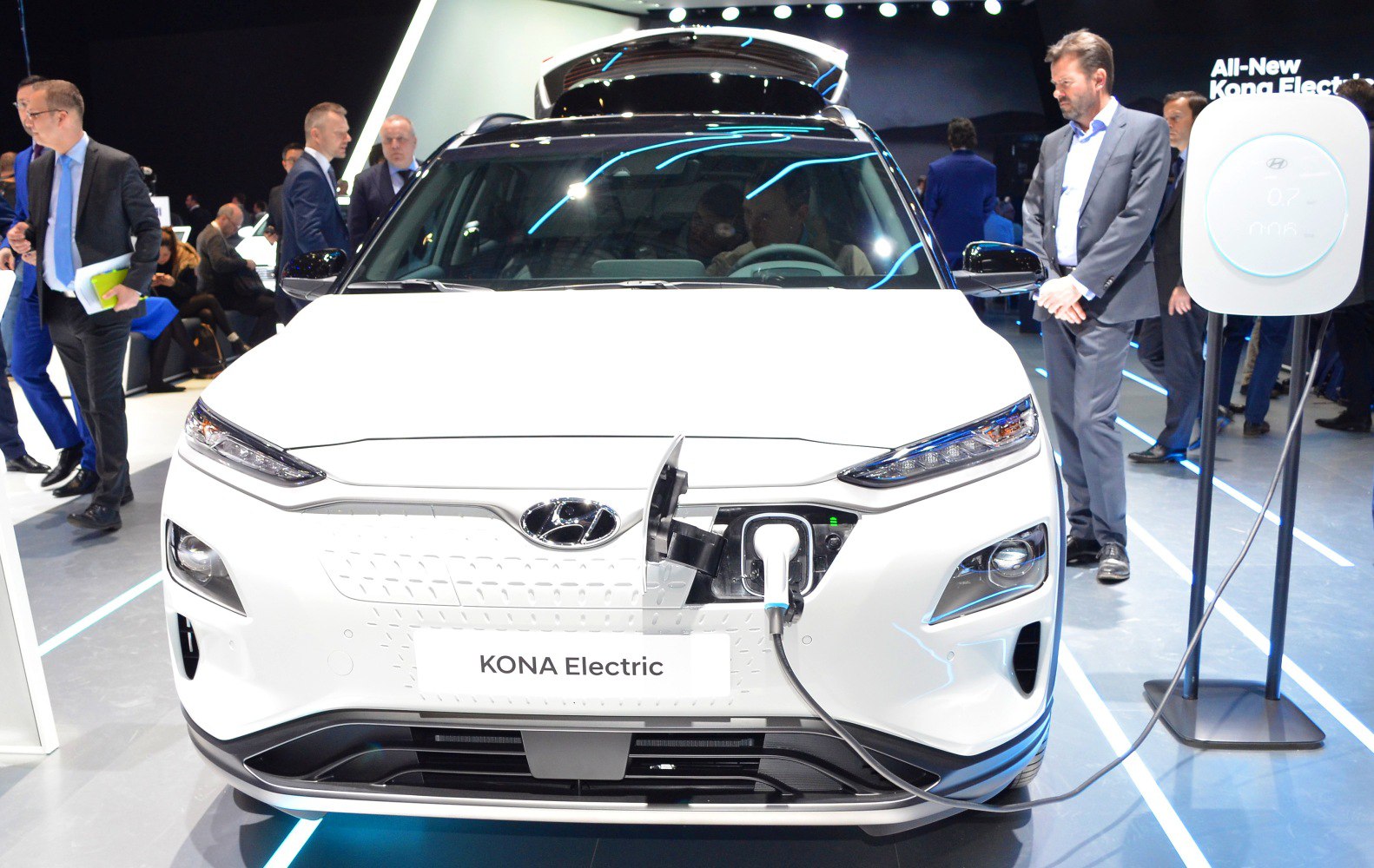 Front view of electric vehicle with LED headlights and charging port