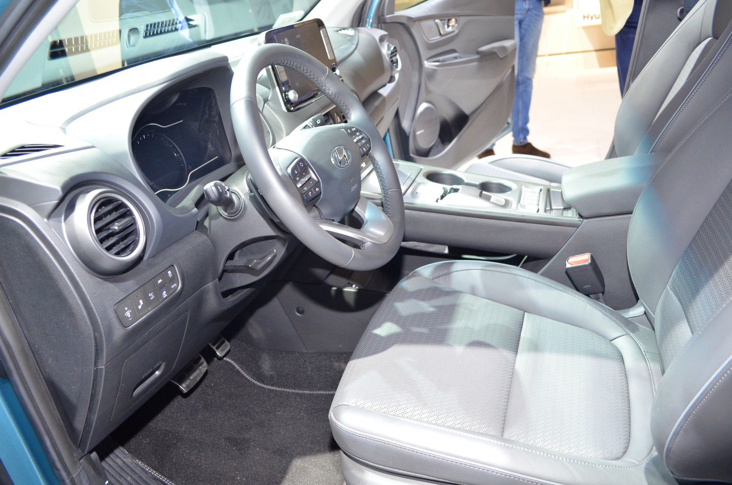 Dashboard, steering wheel, and front seat interior features.