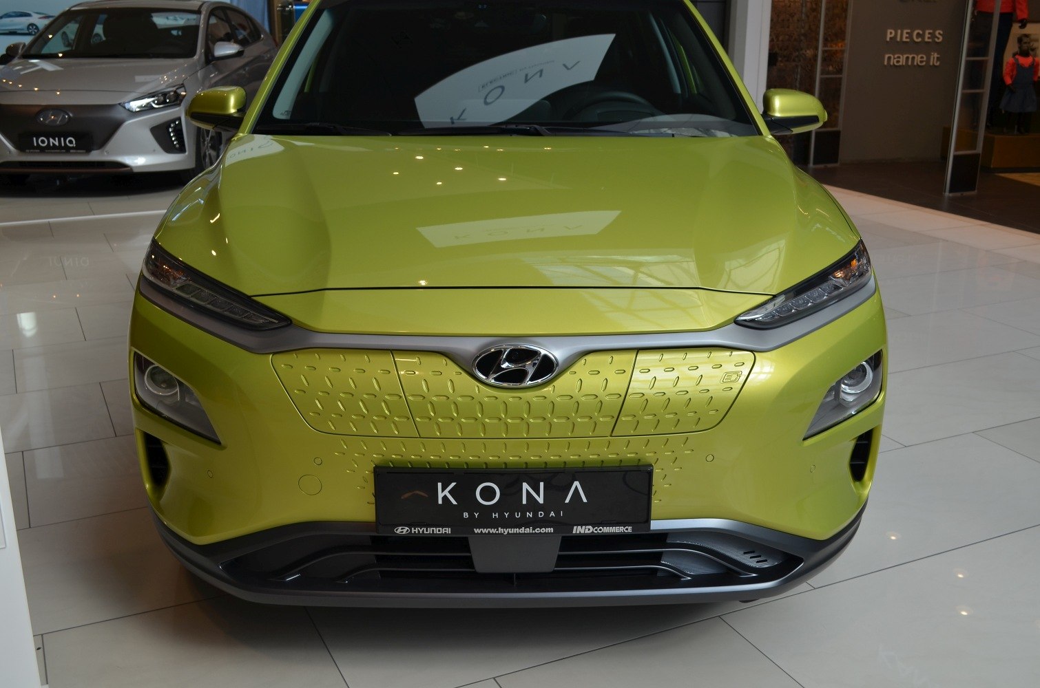 Front view with closed grille and sleek LED headlights