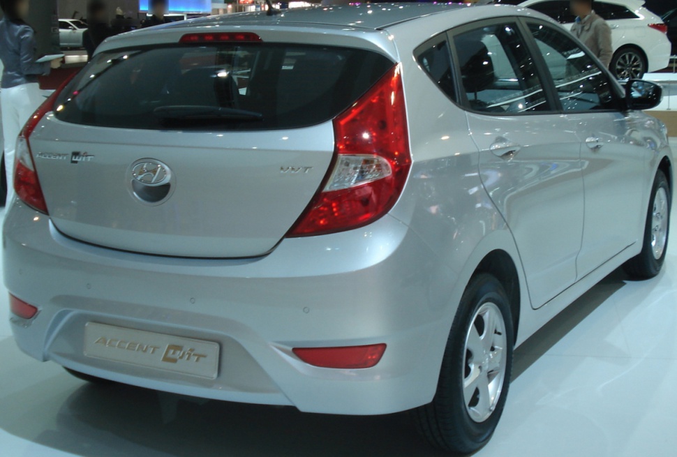 Silver hatchback rear view with distinctive taillights and rear design.
