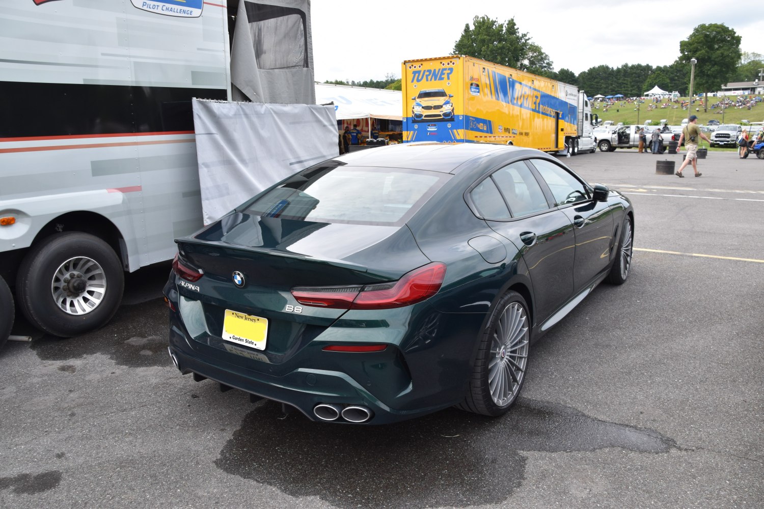 Rear view of luxury sedan with quad exhaust and aerodynamic styling