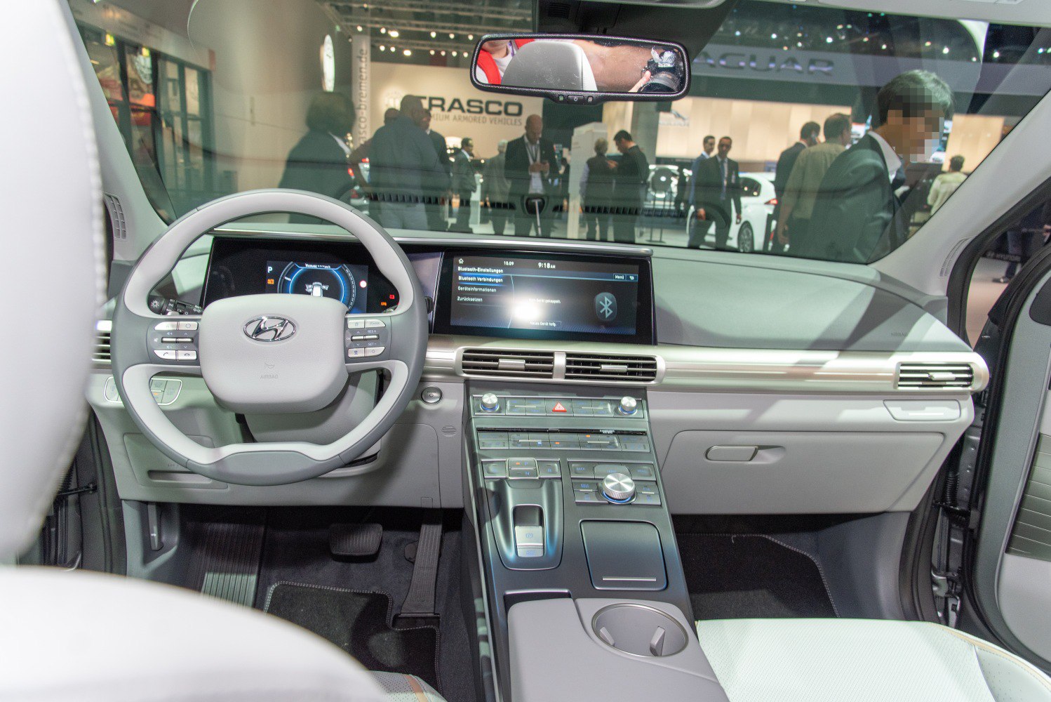 Modern dashboard with digital display and multifunction steering wheel in a car interior
