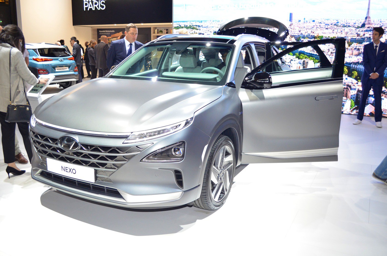 Mid-size SUV front view with modern grille and open driver's door