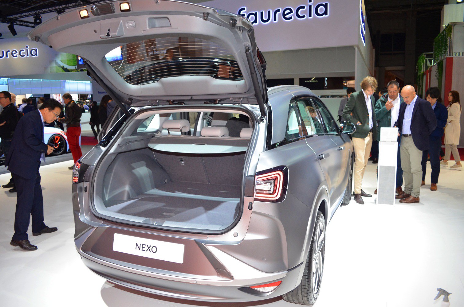 Open rear trunk and distinctive taillights of a modern SUV.