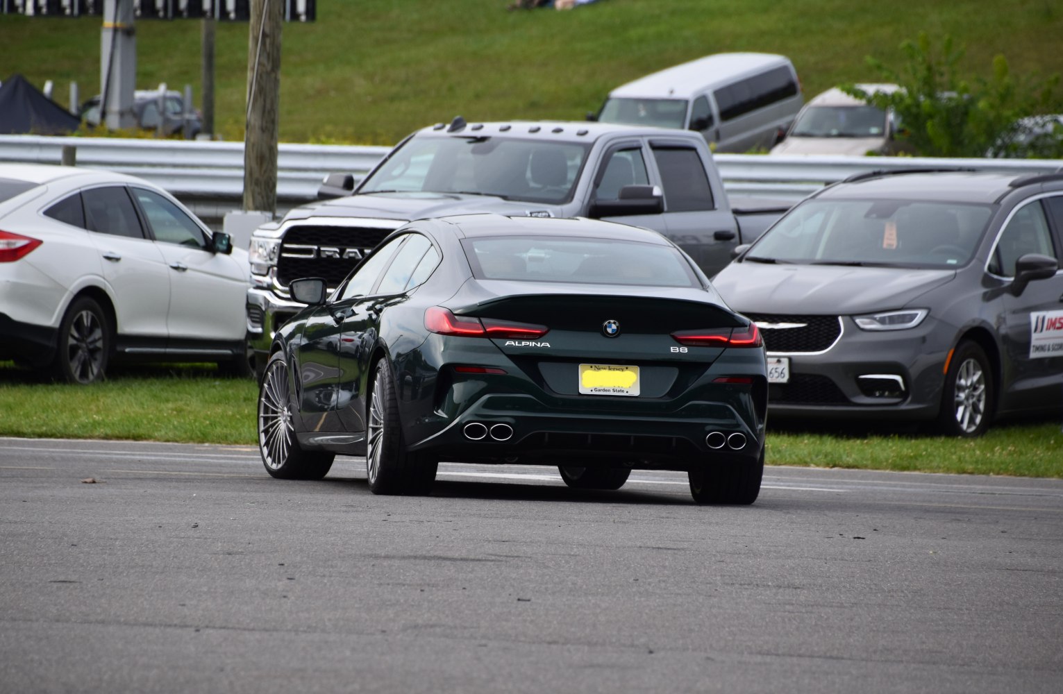 Rear view with quad exhausts and sleek taillights