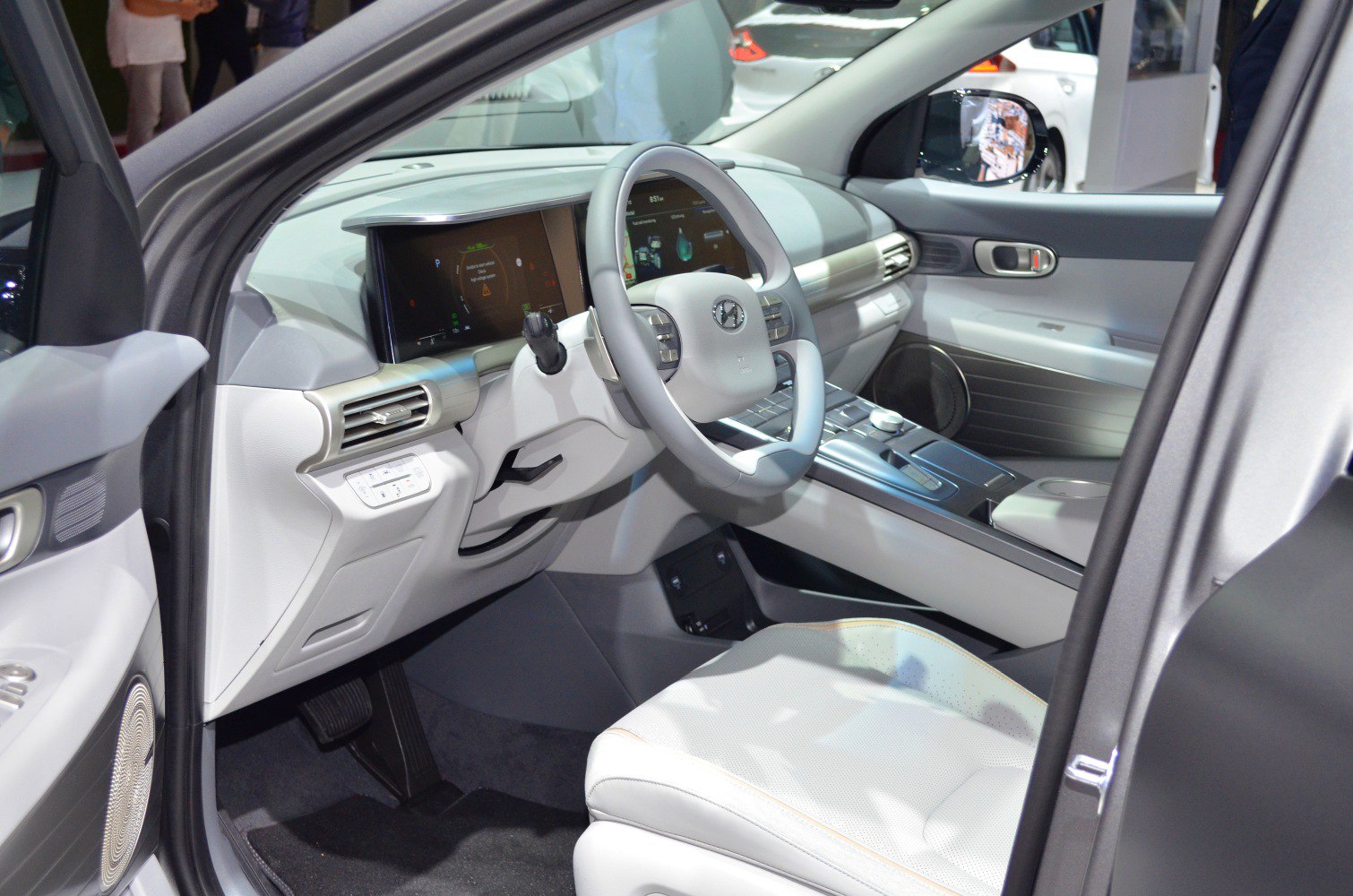 Digital instrument cluster and futuristic steering wheel in car interior