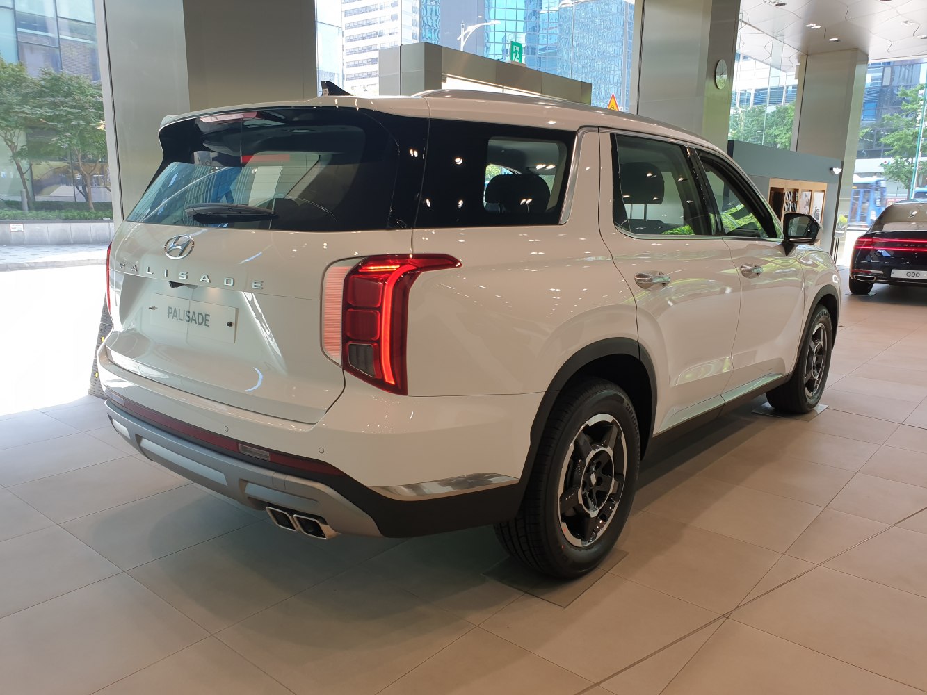 Rear side view with modern taillights and dual exhausts.