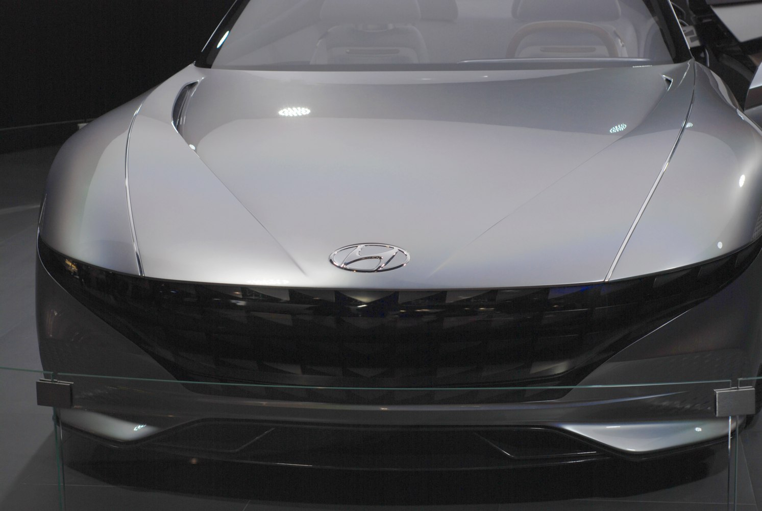 Futuristic front grille and sleek hood with sharp lines
