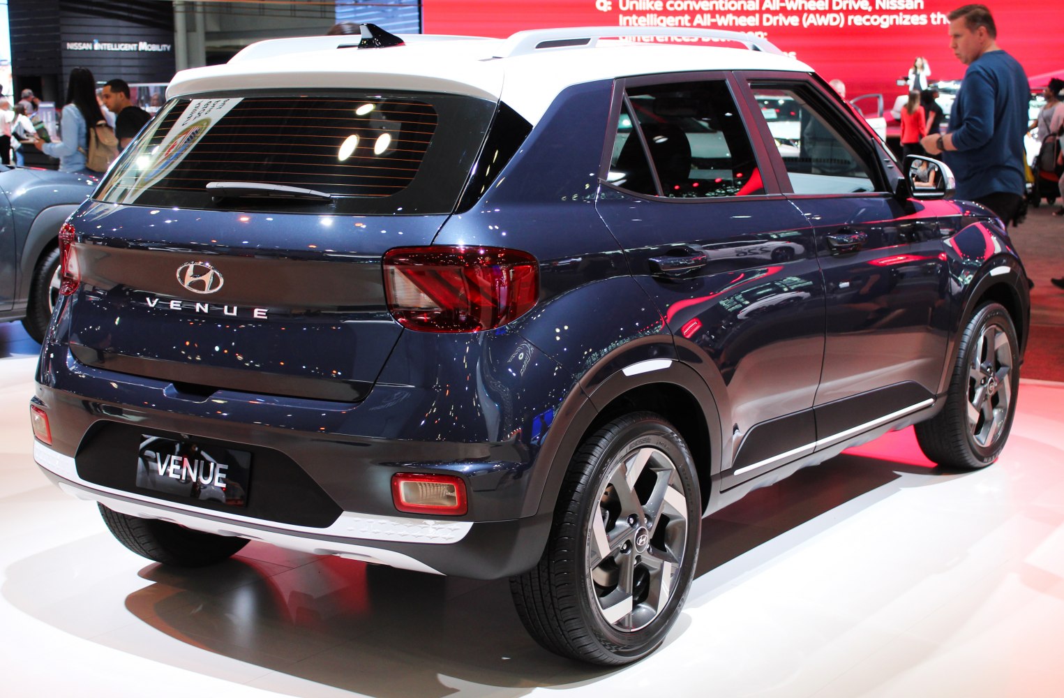 Rear and side view of a compact SUV with distinctive taillights and alloy wheels.