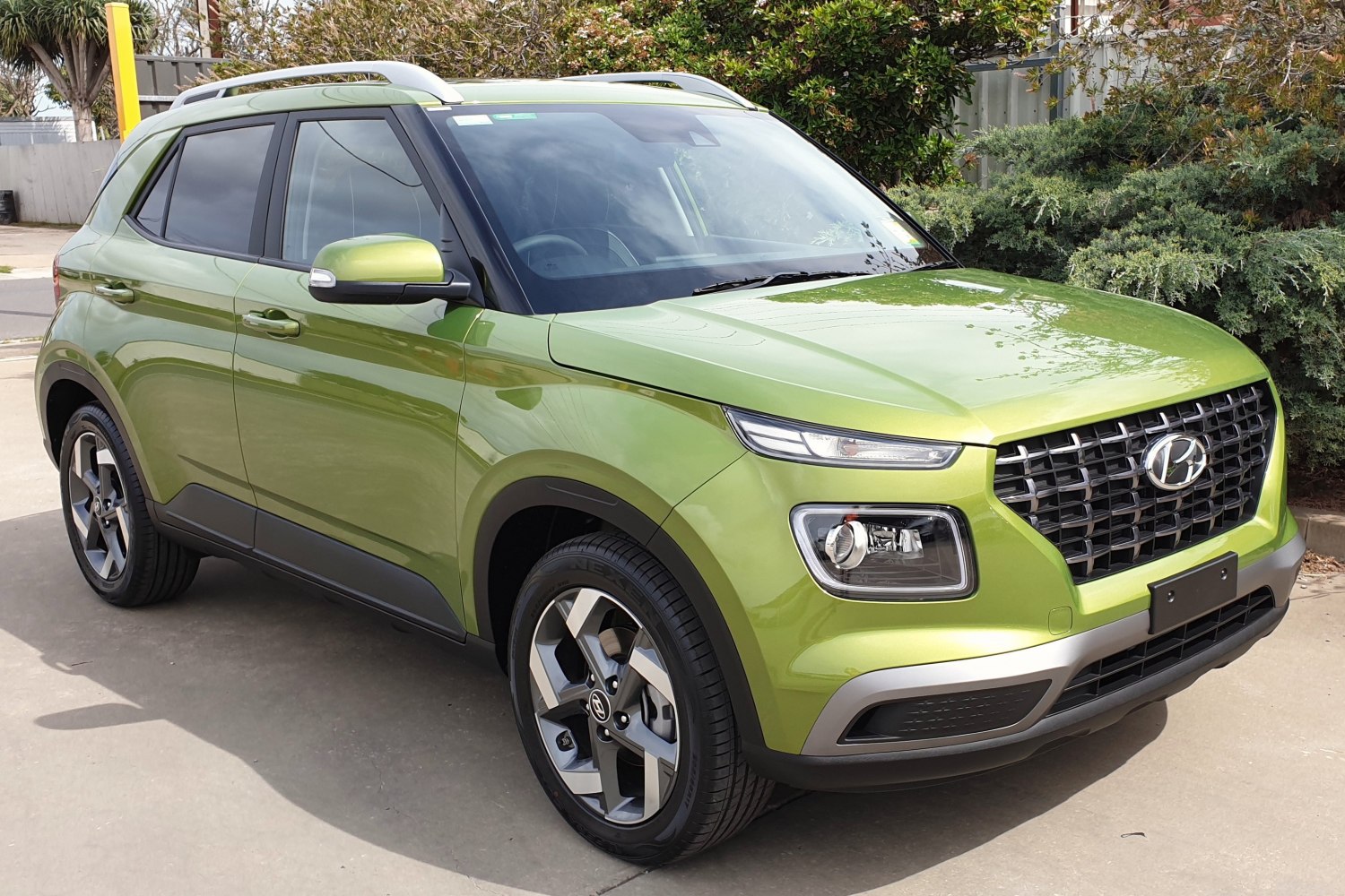 Modern front-side view of compact SUV with distinctive grille and dual headlights