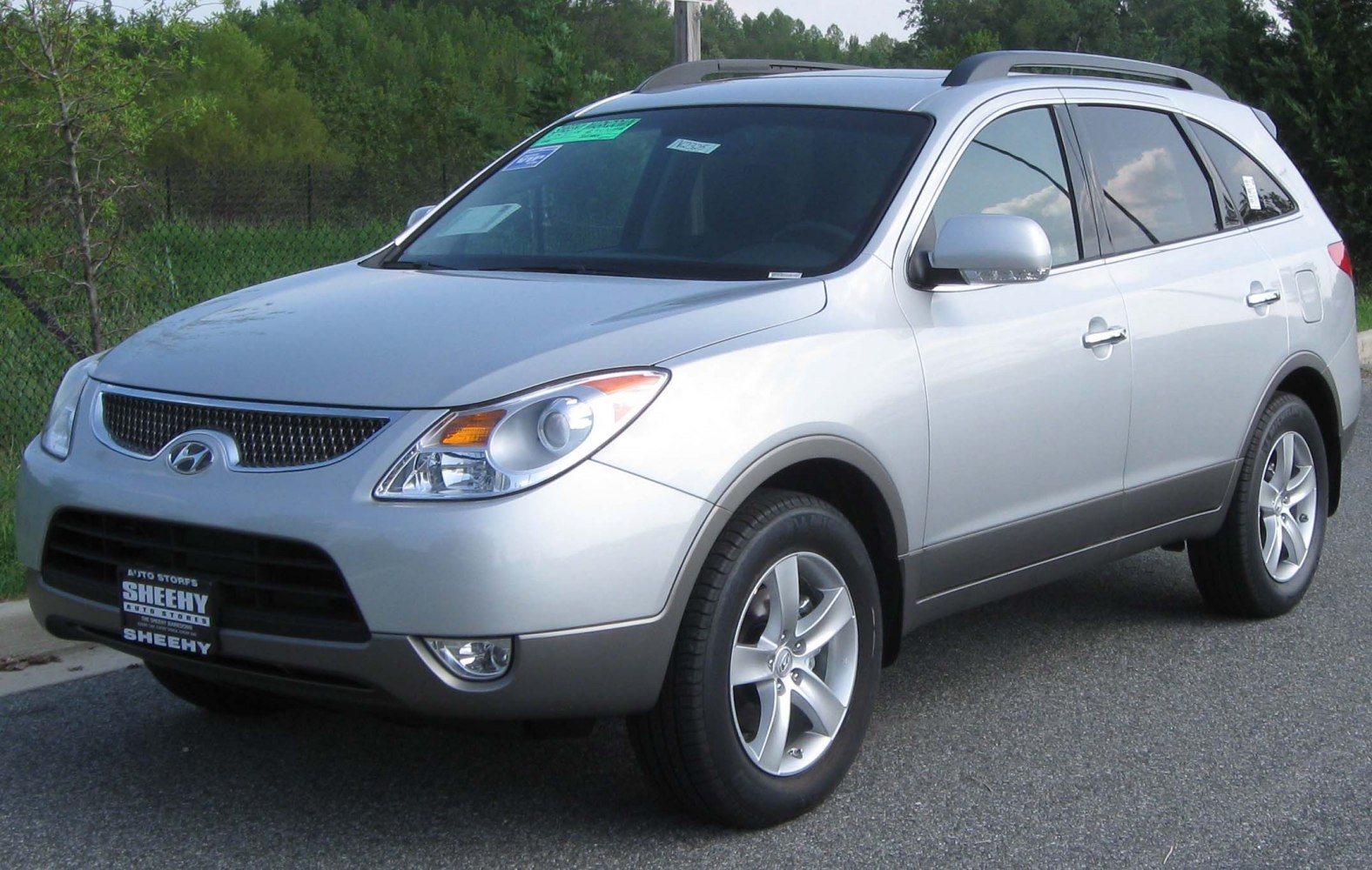 Front-side view of SUV with distinct grille and alloy wheels