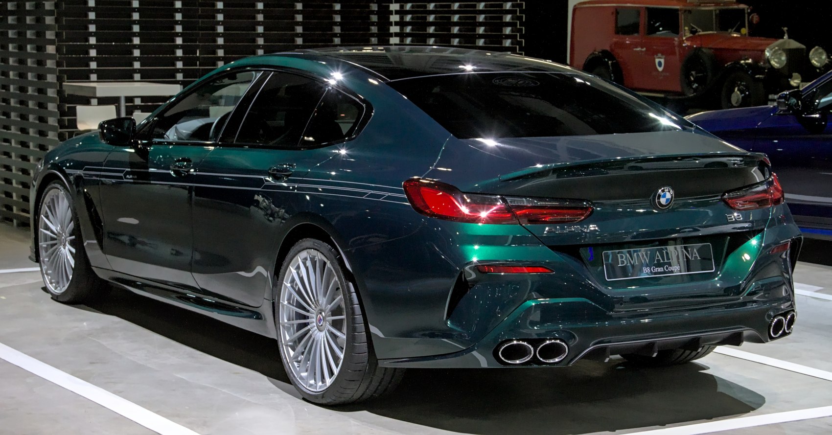 Rear view with quad exhaust and multi-spoke alloy wheels