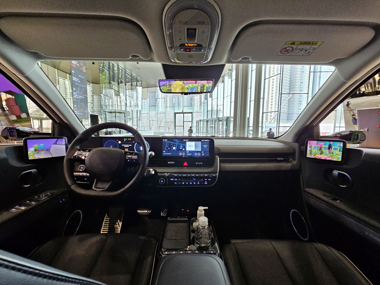Futuristic interior with dual digital displays and modern steering wheel