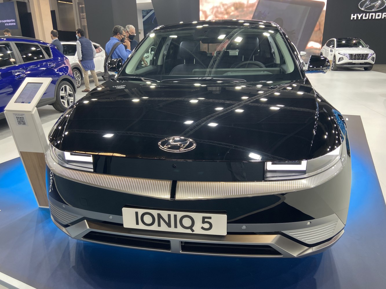 Close-up front of vehicle with LED headlights and smooth hood design